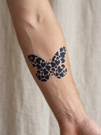 Tatouage Papillon de Cœurs appliqué sur avant-bras