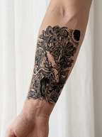 Tatouage Forêt du Dragon appliqué sur avant-bras